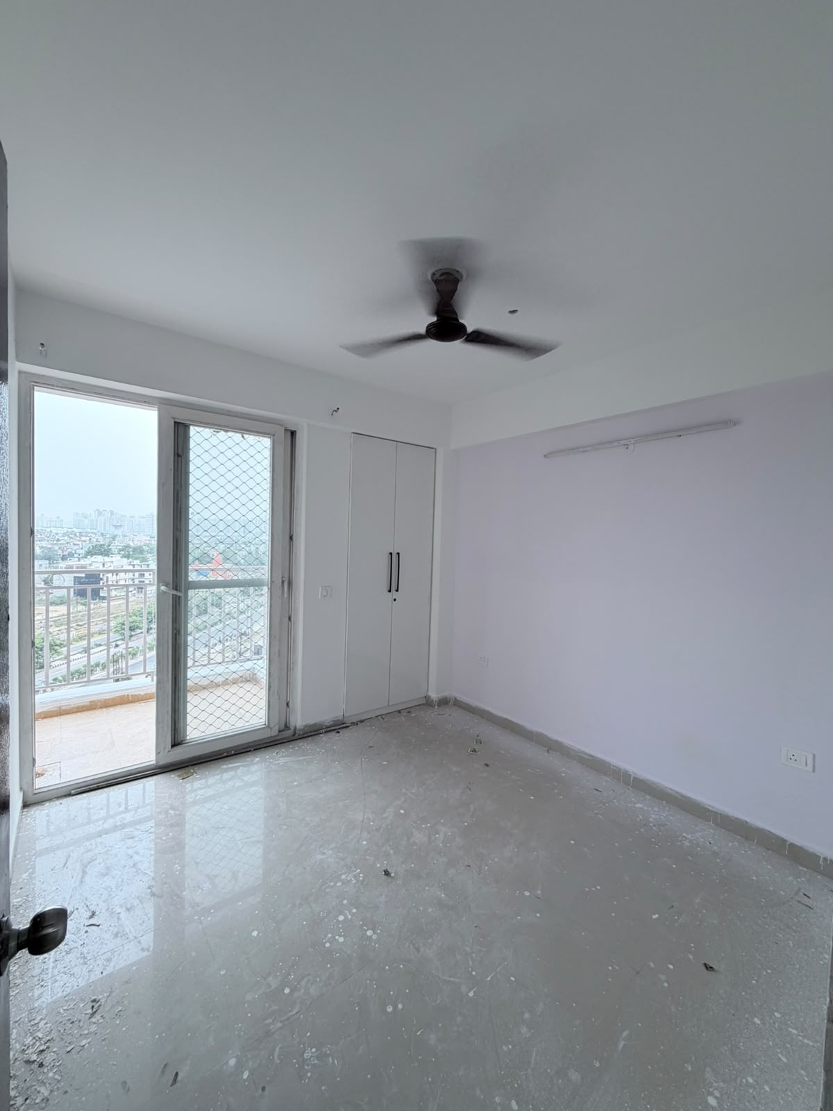 Empty bedroom with built-in wardrobe before Eastern Yard furnishing