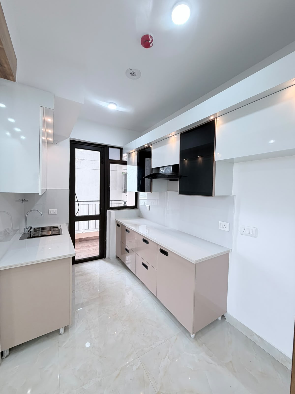 Kitchen with modular cabinets installed but no appliances, before Eastern Yard fit-out